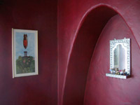 hondo mirror on red walls